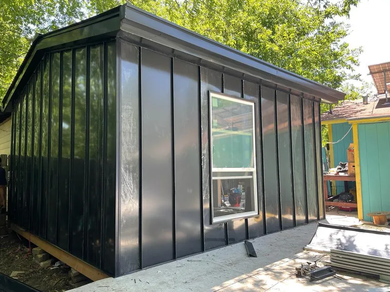 Black standing seam metal wall panels for Roof Inspection in Starkville